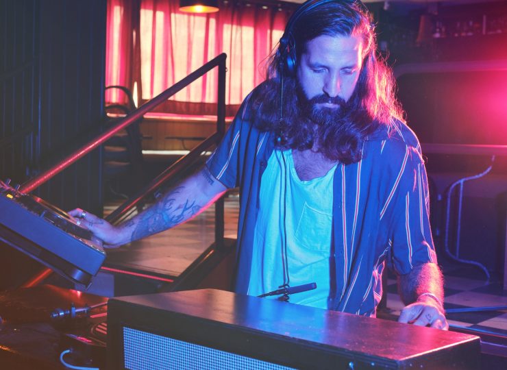 Man playing music at DJ setup