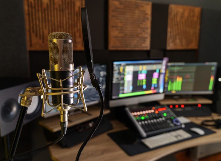Professional microphone in a small music sound production studio workstation